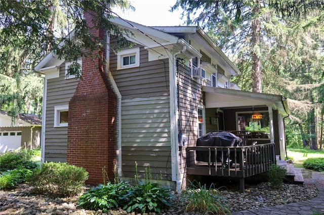 1638 Lake Rd, Pa, PA 16137 - view of property exterior featuring a chimney, a deck, and cooling unit