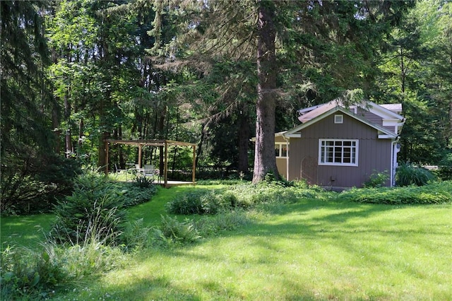 1638 Lake Rd, Pa, PA 16137 - view of green lawn with a pergola and a wooded view