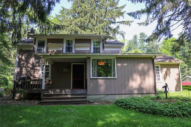 1638 Lake Rd, Pa, PA 16137 - view of front facade with a wooden deck, a front yard, and cooling unit