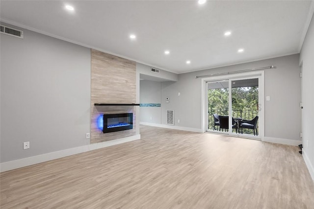 105 Camelot Dr, Mccandless, PA 15237 - unfurnished living room with crown molding, recessed lighting, wood finished floors, and a tiled fireplace