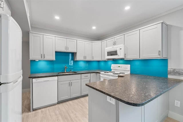 105 Camelot Dr, Mccandless, PA 15237 - kitchen featuring white appliances, light wood-style flooring, ornamental molding, dark countertops, and recessed lighting