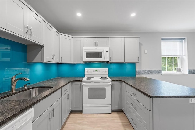 105 Camelot Dr, Mccandless, PA 15237 - kitchen with white appliances, ornamental molding, a peninsula, light wood finished floors, and recessed lighting
