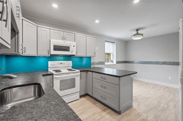 105 Camelot Dr, Mccandless, PA 15237 - kitchen featuring white appliances, ornamental molding, a peninsula, light wood-style flooring, and recessed lighting