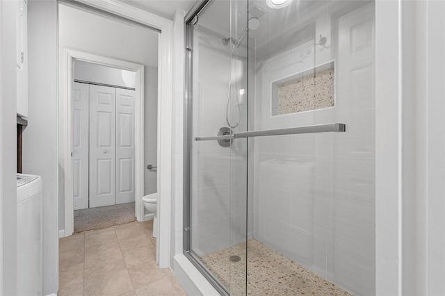 105 Camelot Dr, Mccandless, PA 15237 - bathroom with a shower stall, a closet, washer / dryer, and tile patterned flooring
