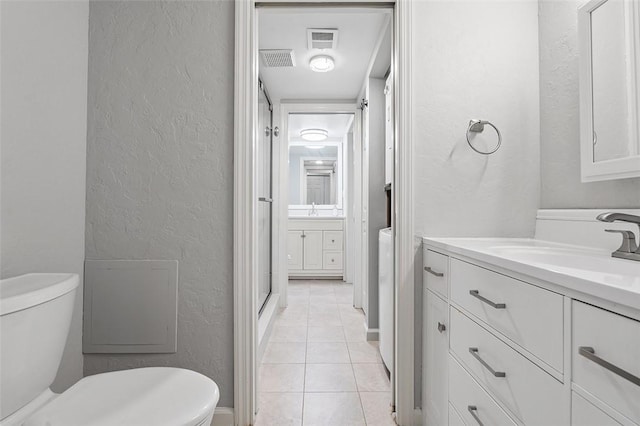 105 Camelot Dr, Mccandless, PA 15237 - bathroom featuring a textured wall, vanity, tile patterned floors, and a shower stall