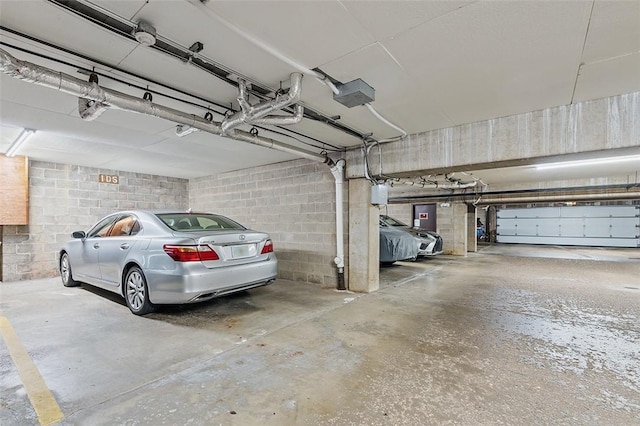 105 Camelot Dr, Mccandless, PA 15237 - parking deck with electric panel, a garage door opener, and concrete block wall