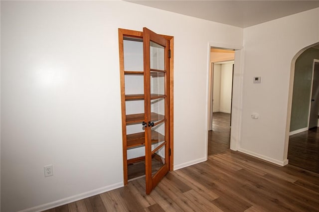 539 Park Ave, Monongahela, PA 15063 - unfurnished room featuring arched walkways, wood finished floors, and french doors