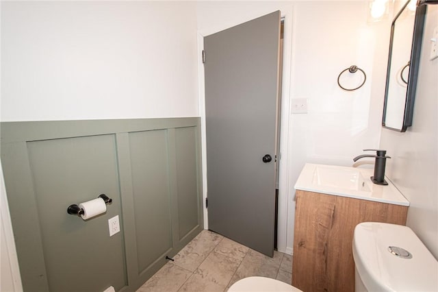 539 Park Ave, Monongahela, PA 15063 - half bathroom with vanity, wainscoting, and a decorative wall