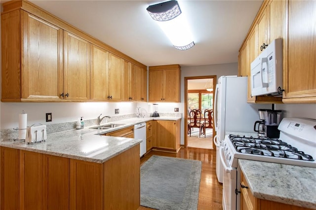 311 Oxbridge Ct, Ohara, PA 15238 - kitchen featuring white appliances, a peninsula, wood finished floors, and light stone counters