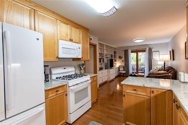 311 Oxbridge Ct, Ohara, PA 15238 - kitchen featuring white appliances, wood finished floors, open floor plan, and light stone countertops