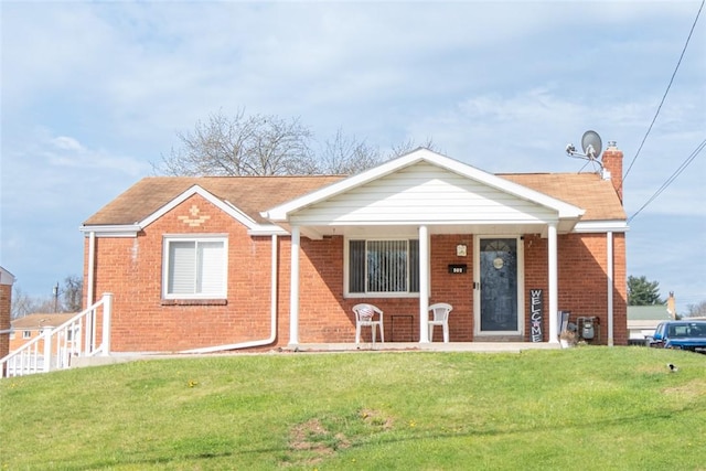 502 Lebanon Manor Dr, West Mifflin, PA 15122 - view of front of home featuring brick siding, a front lawn, and a porch