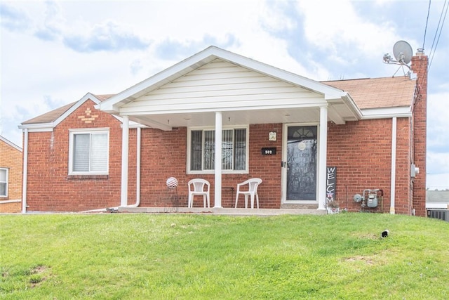 502 Lebanon Manor Dr, West Mifflin, PA 15122 - view of front of house featuring brick siding, a front yard, a chimney, and a shingled roof