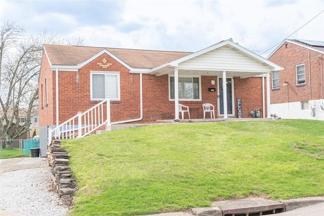 502 Lebanon Manor Dr, West Mifflin, PA 15122 - view of front facade featuring brick siding, a front lawn, and covered porch