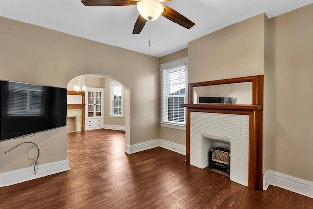 122 Haldane St, Crafton, PA 15205 - unfurnished living room with arched walkways, wood finished floors, and ceiling fan