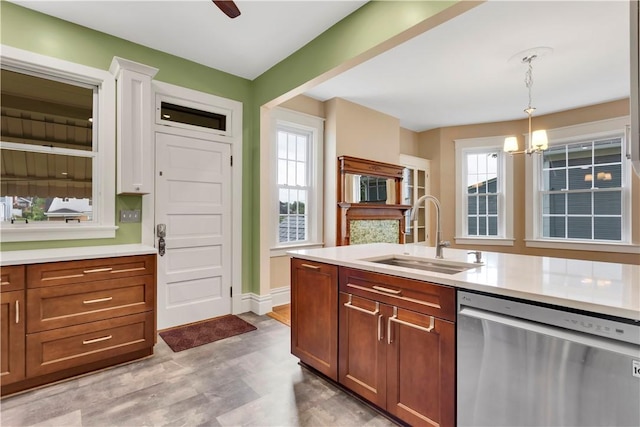122 Haldane St, Crafton, PA 15205 - kitchen with dishwasher, light countertops, hanging light fixtures, a chandelier, and light wood finished floors