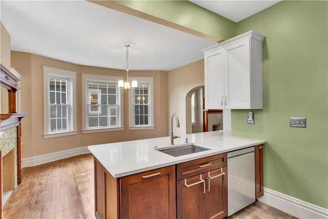 122 Haldane St, Crafton, PA 15205 - kitchen featuring dishwasher, a chandelier, white cabinetry, light countertops, and hanging light fixtures