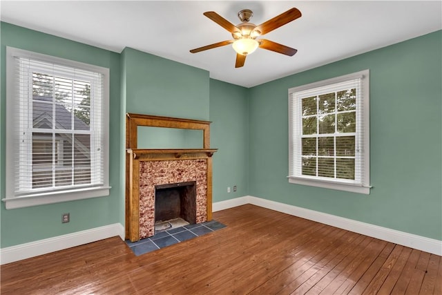 122 Haldane St, Crafton, PA 15205 - unfurnished living room featuring wood-type flooring, plenty of natural light, a tile fireplace, and ceiling fan