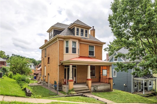 122 Haldane St, Crafton, PA 15205 - view of front of property with a chimney, brick siding, covered porch, and a front yard