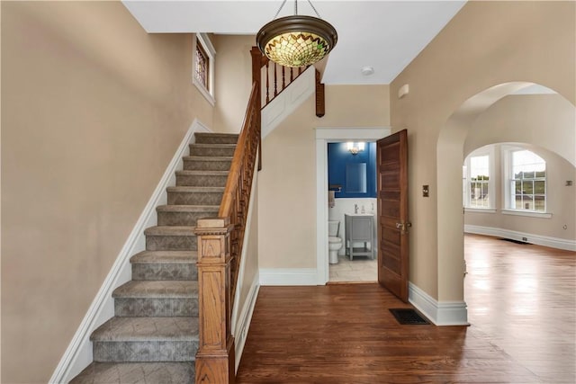 122 Haldane St, Crafton, PA 15205 - stairs featuring wood finished floors and arched walkways