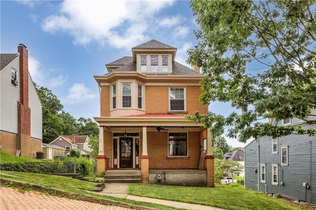 122 Haldane St, Crafton, PA 15205 - traditional style home with brick siding, covered porch, roof with shingles, and a ceiling fan