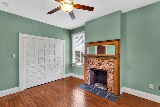 122 Haldane St, Crafton, PA 15205 - unfurnished living room with hardwood / wood-style flooring, ceiling fan, and a tiled fireplace