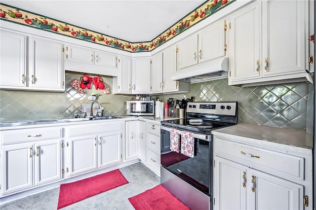 965 Dalton Ave, Hermitage, PA 16148 - kitchen featuring appliances with stainless steel finishes, under cabinet range hood, stainless steel countertops, white cabinetry, and tasteful backsplash