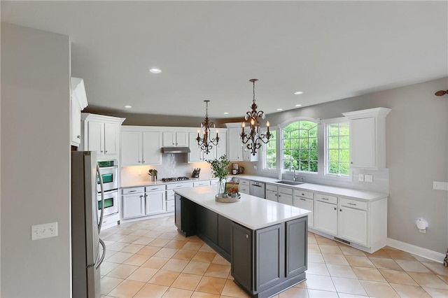 4127 Duckhorn Dr, Moon/Crescent Twp, PA 15108 - kitchen featuring stainless steel appliances, light countertops, a center island, white cabinetry, and recessed lighting