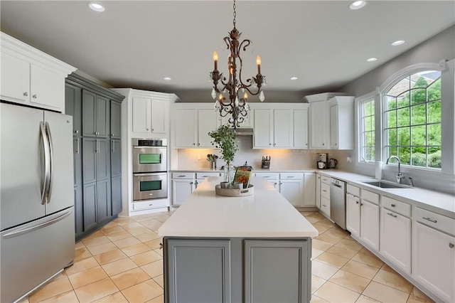 4127 Duckhorn Dr, Moon/Crescent Twp, PA 15108 - kitchen featuring stainless steel appliances, gray cabinetry, a center island, recessed lighting, and light countertops