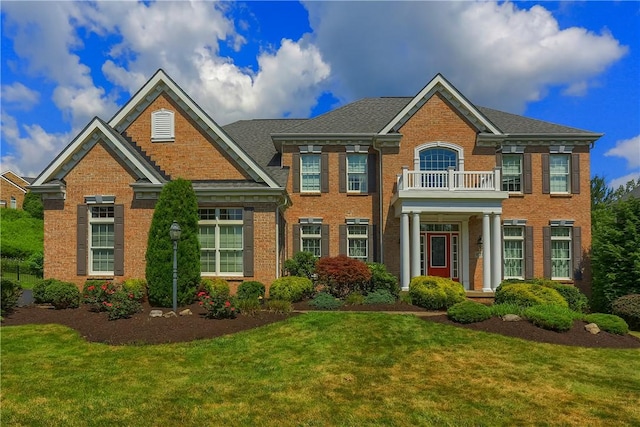 4127 Duckhorn Dr, Moon/Crescent Twp, PA 15108 - colonial-style house featuring brick siding, a front yard, and a balcony