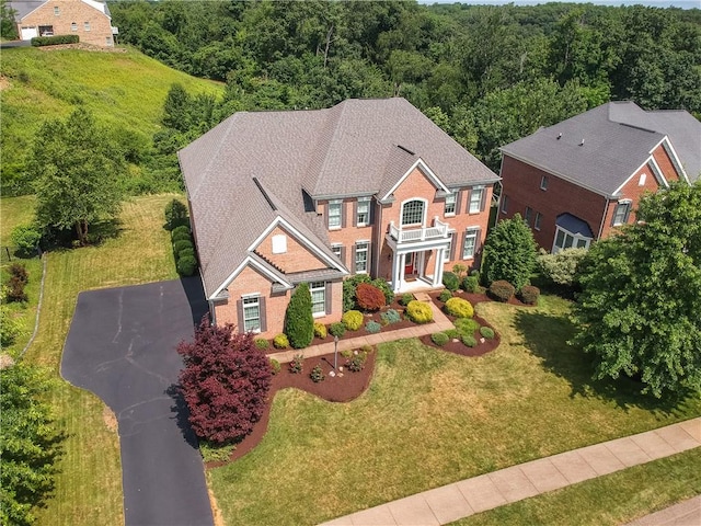 4127 Duckhorn Dr, Moon/Crescent Twp, PA 15108 - view of front facade featuring a front lawn, a forest view, and brick siding