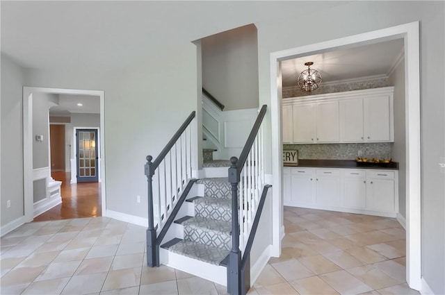 4127 Duckhorn Dr, Moon/Crescent Twp, PA 15108 - stairway with tile patterned floors, a chandelier, and crown molding