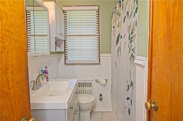 1109 N 2nd St, Jeannette, PA 15644 - bathroom featuring vanity, radiator, and a shower with curtain