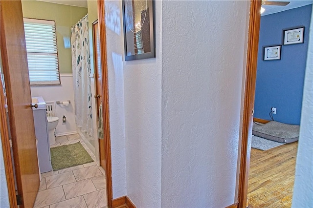 1109 N 2nd St, Jeannette, PA 15644 - bathroom featuring a textured wall and curtained shower