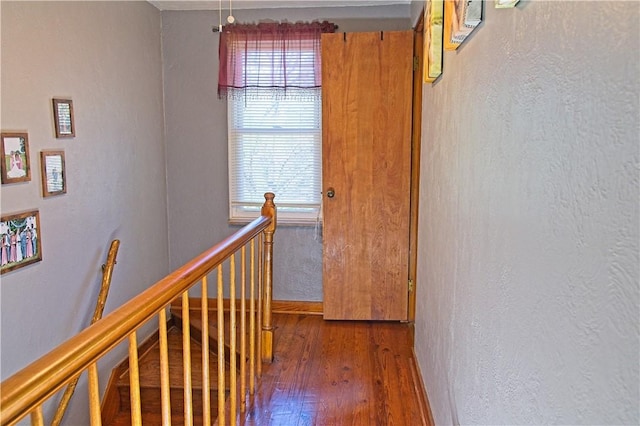 1109 N 2nd St, Jeannette, PA 15644 - hallway featuring plenty of natural light, an upstairs landing, wood finished floors, and a textured wall