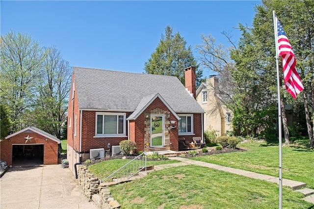 1109 N 2nd St, Jeannette, PA 15644 - english style home with a garage, an outdoor structure, brick siding, and a front lawn