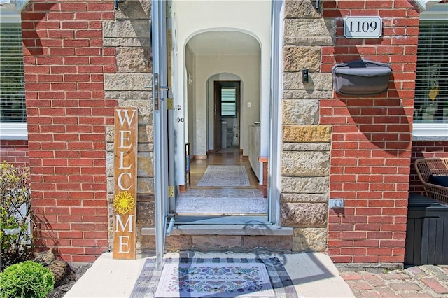 1109 N 2nd St, Jeannette, PA 15644 - doorway to property with brick siding