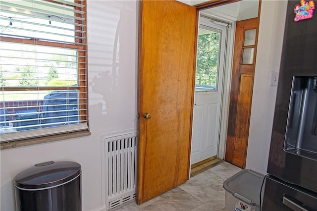 1109 N 2nd St, Jeannette, PA 15644 - doorway with light marble finish floors and radiator heating unit