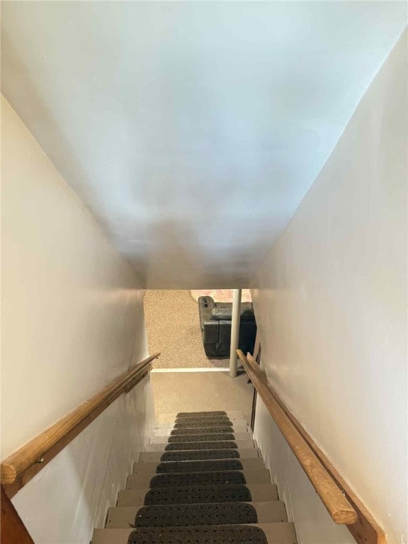 1109 N 2nd St, Jeannette, PA 15644 - staircase featuring carpet flooring