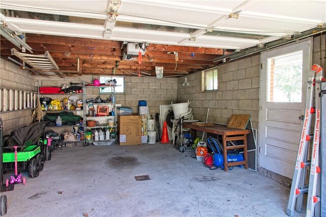 1109 N 2nd St, Jeannette, PA 15644 - garage featuring concrete block wall and a garage door opener