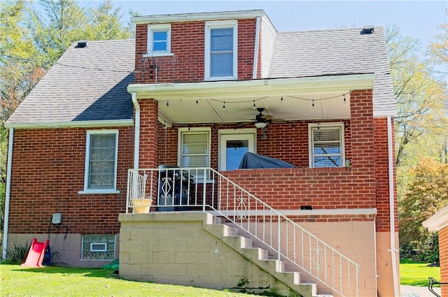 1109 N 2nd St, Jeannette, PA 15644 - view of front of home featuring brick siding, a ceiling fan, and a shingled roof