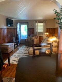 19 Charles St, Dravosburg, PA 15034 - bedroom featuring a wainscoted wall, wooden walls, wood finished floors, and cooling unit