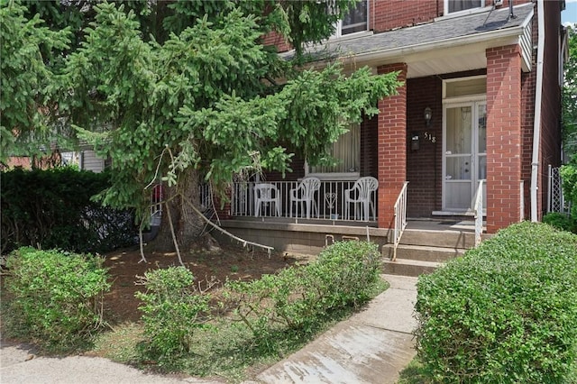 518 N Saint Clair St, East Liberty, PA 15206 - doorway to property with a porch and brick siding