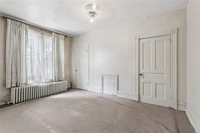 518 N Saint Clair St, East Liberty, PA 15206 - spare room with radiator heating unit and carpet floors