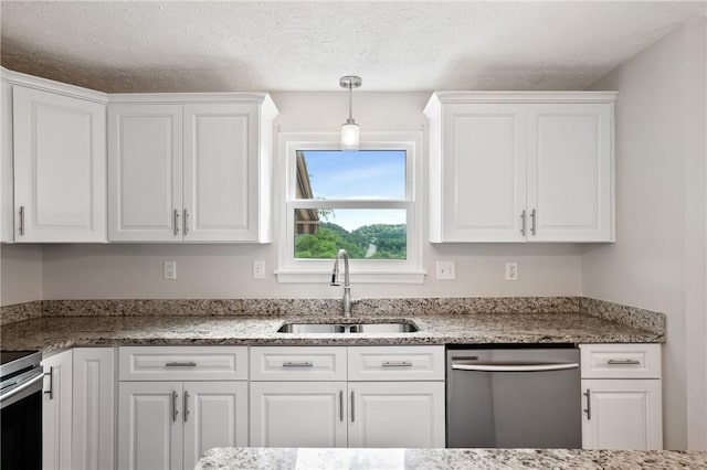 249 Clare Dr, North Strabane, PA 15317 - kitchen featuring stainless steel dishwasher, white cabinets, decorative light fixtures, and a textured ceiling