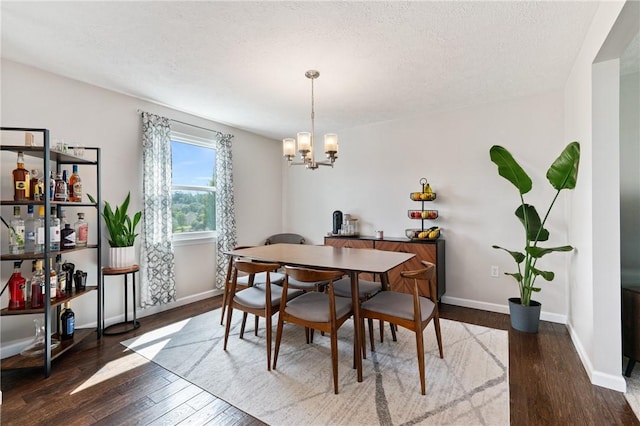 249 Clare Dr, North Strabane, PA 15317 - dining room with a chandelier, hardwood / wood-style flooring, and a textured ceiling