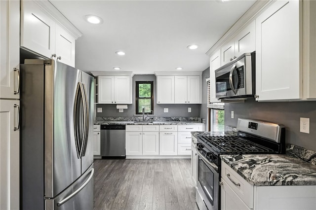 616 Highview Rd, Baldwin Twp, PA 15234 - kitchen featuring stainless steel appliances, light wood finished floors, stone countertops, white cabinetry, and recessed lighting