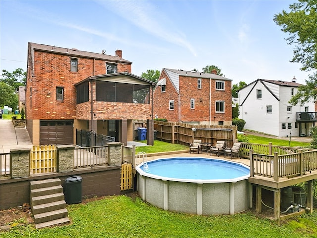 616 Highview Rd, Baldwin Twp, PA 15234 - view of swimming pool featuring a sunroom and a deck