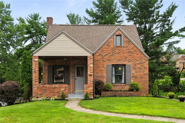 616 Highview Rd, Baldwin Twp, PA 15234 - tudor-style house featuring a front yard and brick siding