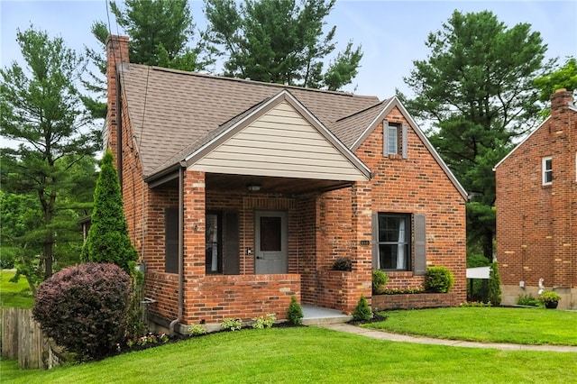 616 Highview Rd, Baldwin Twp, PA 15234 - view of front of house featuring brick siding, a chimney, and roof with shingles