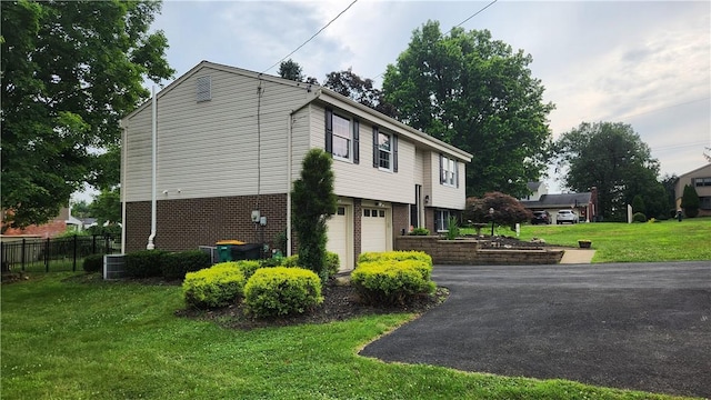 2583 Richard Rd, Franklin Park, PA 15090 - view of home's exterior featuring asphalt driveway, a garage, and brick siding